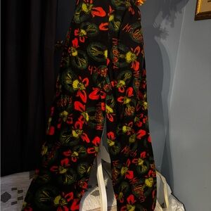 Dr. Seuss The Grinch Black, Red and Green Patterned Fleece Drawstring Pants..